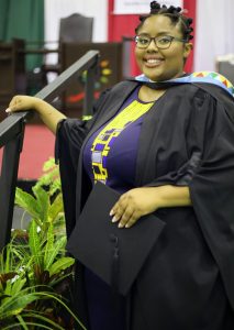 UKZN staff member Ms Thulile Zama graduates with her Honours degree in Social Sciences.
